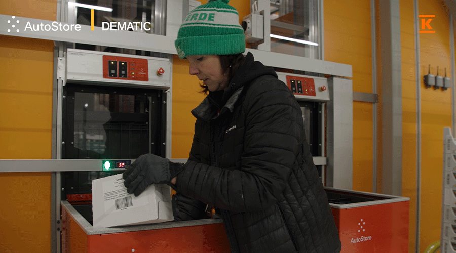 Woman picking groceries from Kesko AutoStore Grid in Finland 