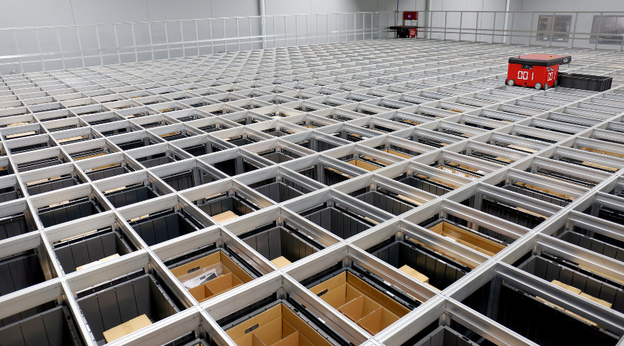 An AutoStore grid with bins containing products