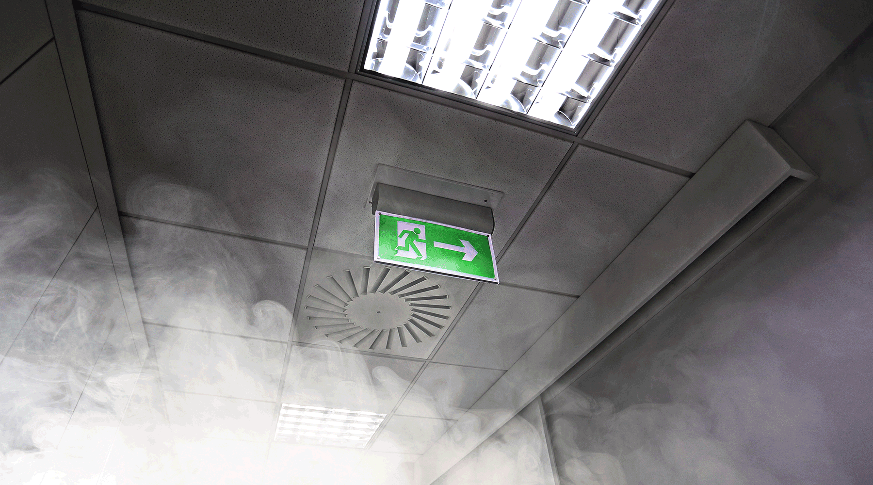 Smoke near a stairwell entry sign