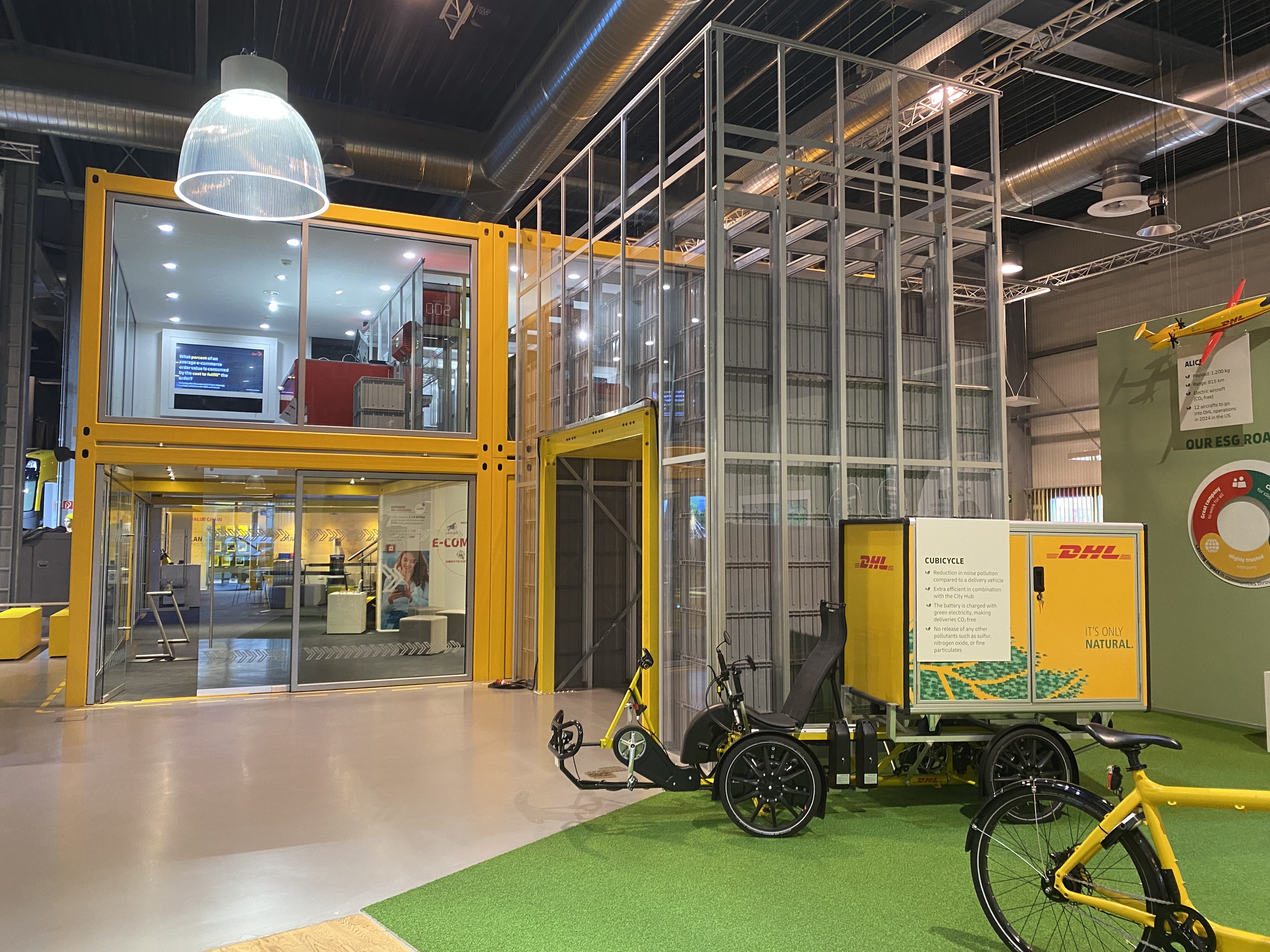 DHL eBike standing in front of the AutoStore System at the DHL Innovation Center. Photo.