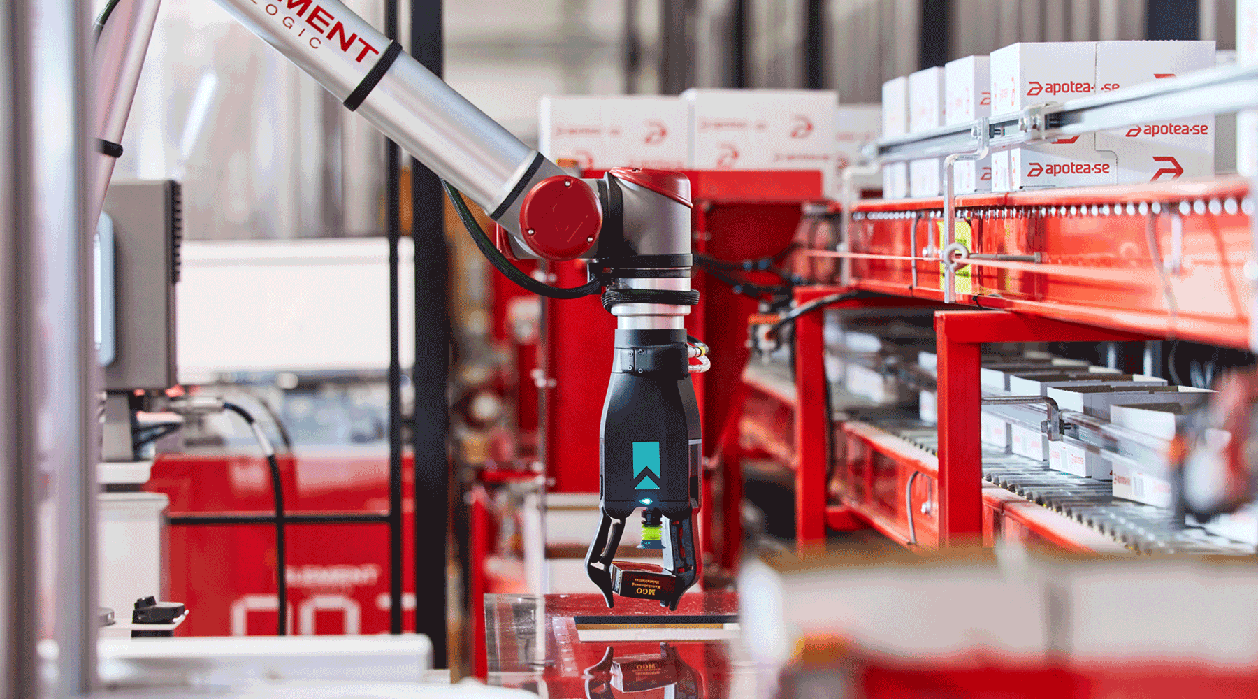 A robotic picking arm moving a product within an AutoStore system.